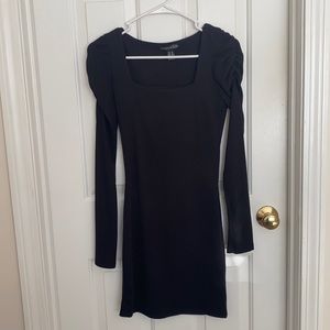 Simple black dress with detailing on shoulders